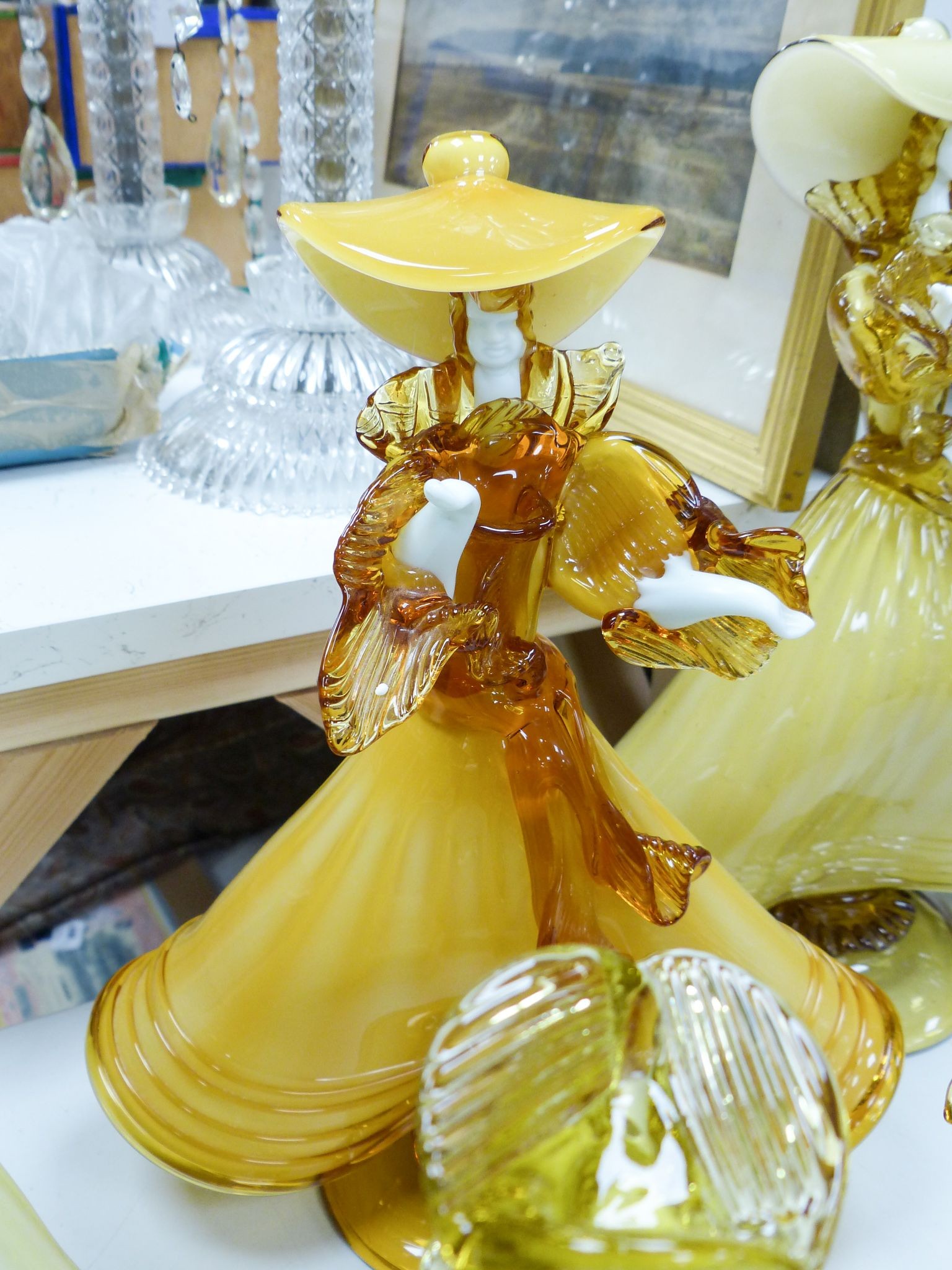 A collection of eight Murano amber glass figures, tallest 42cm